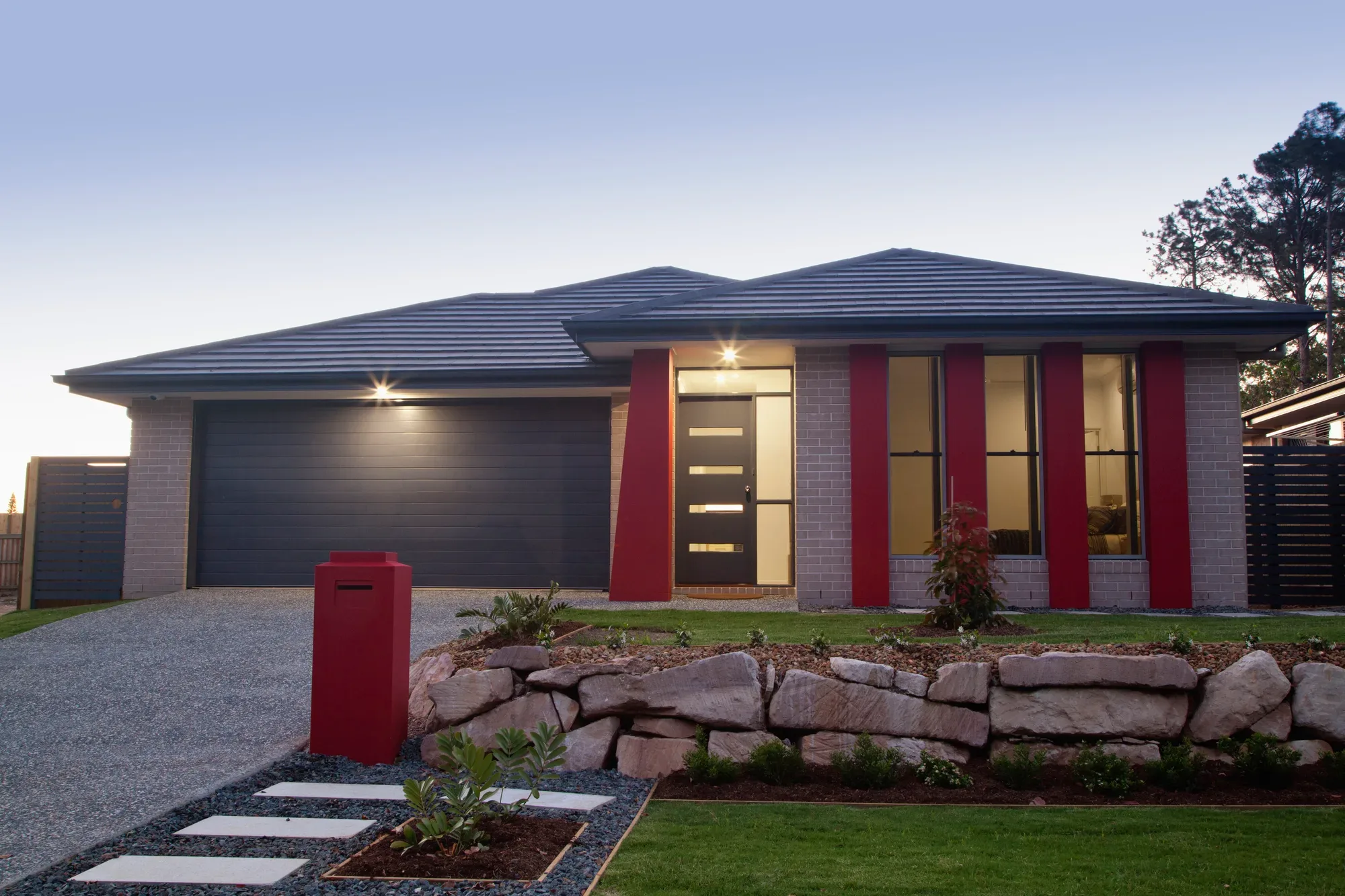 A replacement concrete driveway and garage slab on a standard Miller block