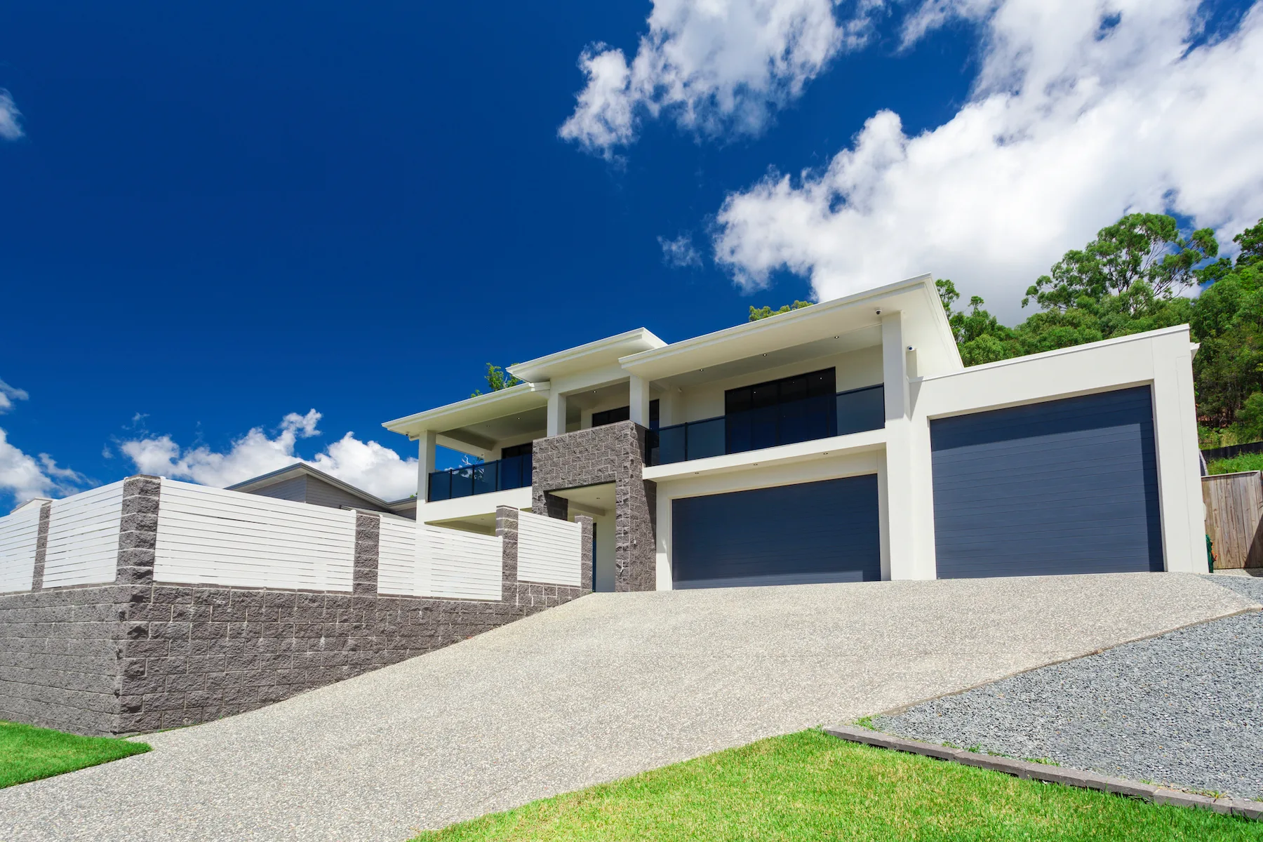 A newly poured concrete driveway leading to a garage in the Liverpool area