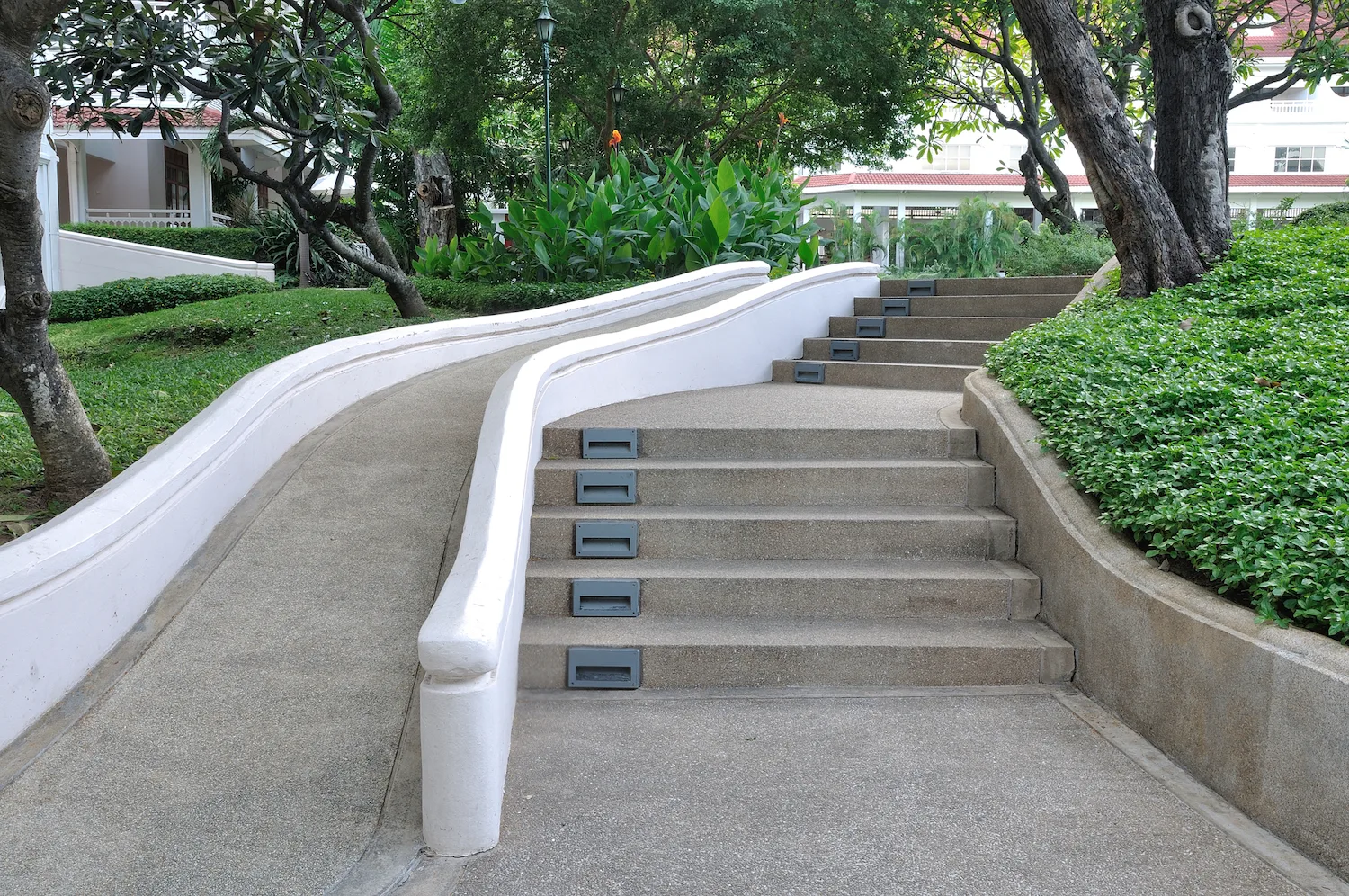 A concrete ramp between entrance levels on a Miller home