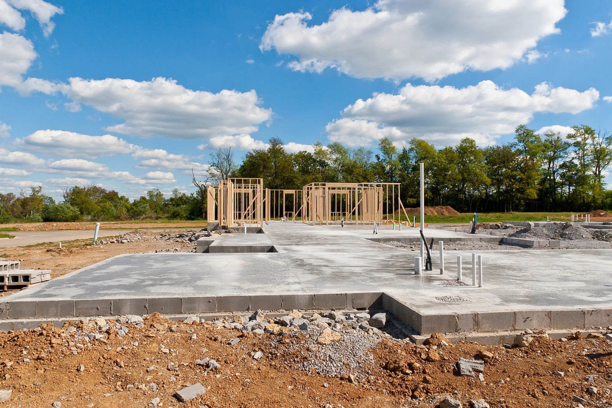 A new concrete slab foundation being poured and reinforced on a Liverpool area building site